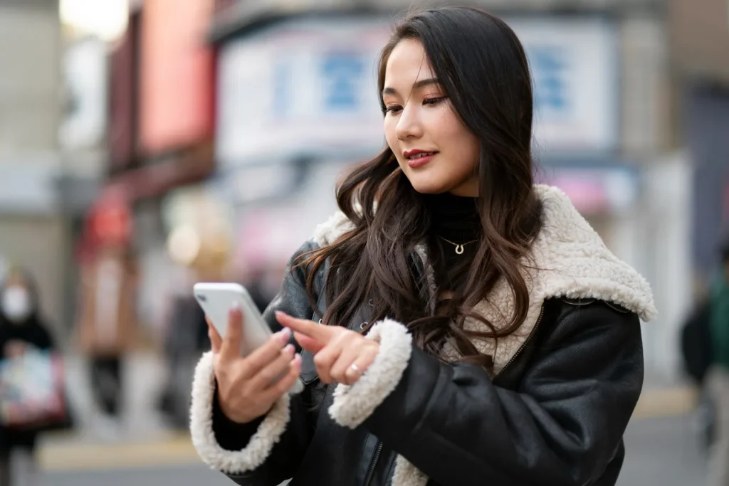 Japanese woman using phone Japanese woman using phone