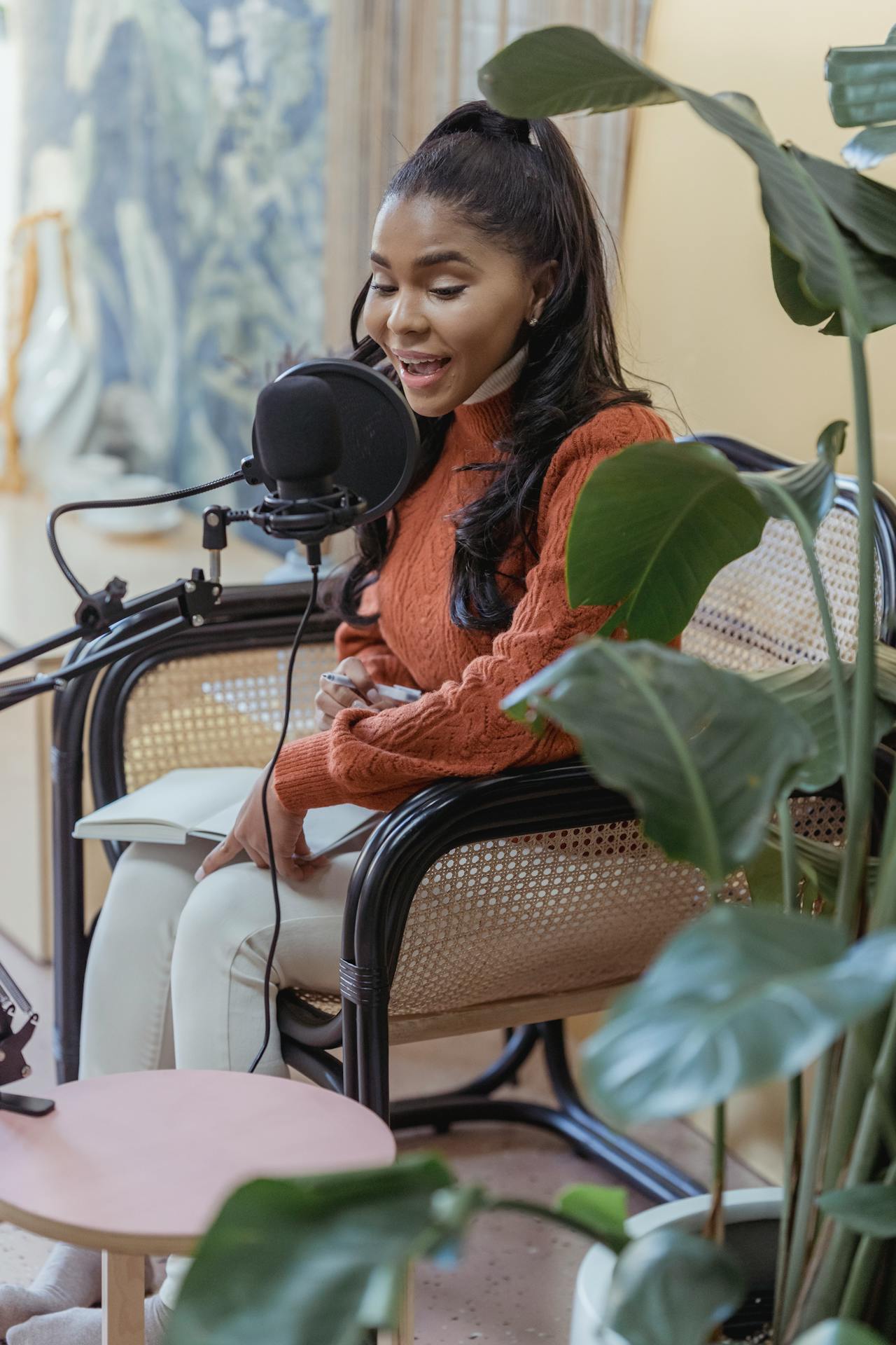 Podcast team recording in a studio with microphones