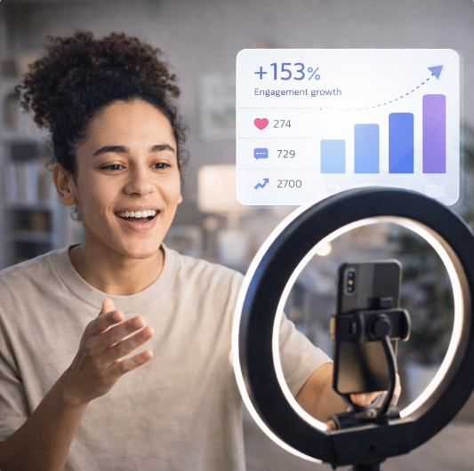 a woman smiling and looking at a screen with a phone a woman smiling and looking at a screen with a phone