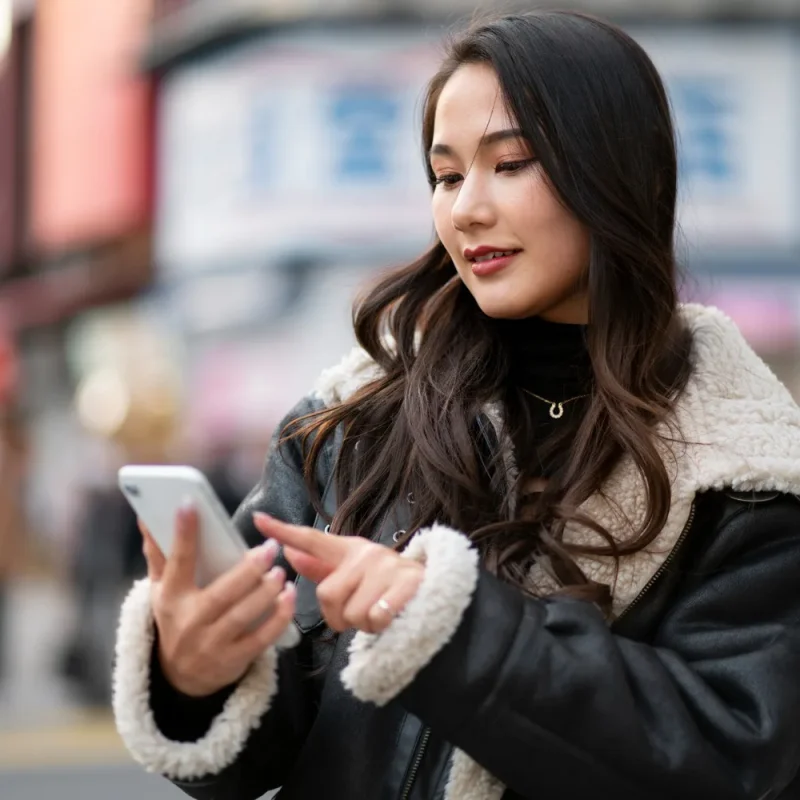 Japanese woman using phone Japanese woman using phone